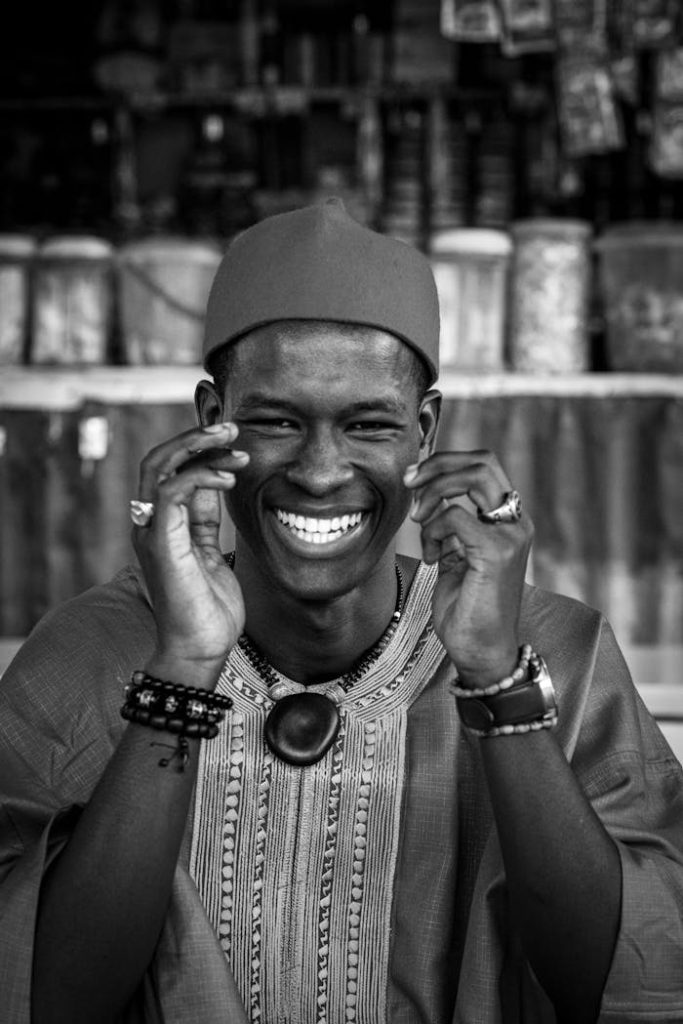 smiling-man-in-traditional-african-attire-29943194